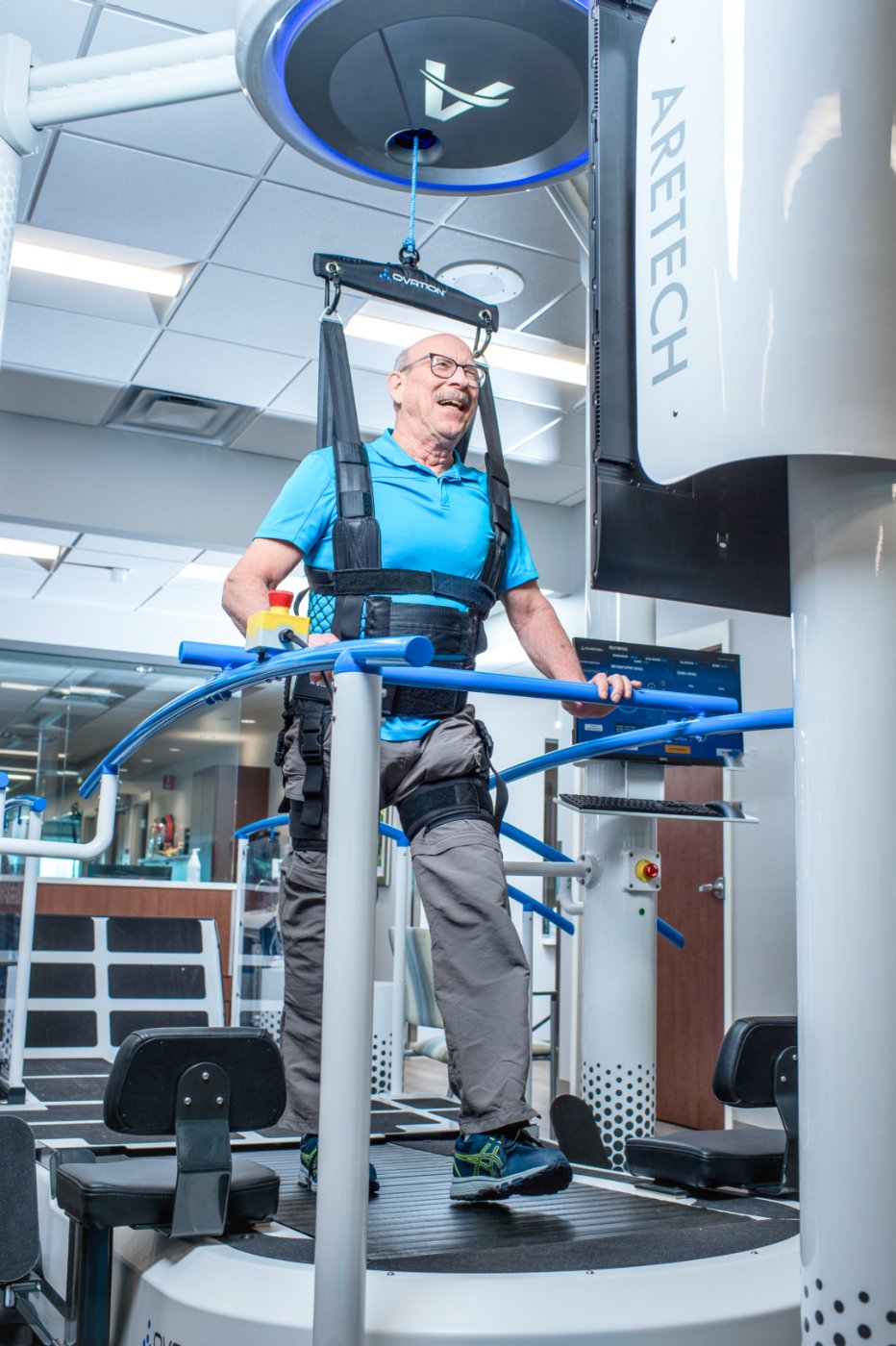 Patient walking in the Ovation harness with dynamic body-weight support