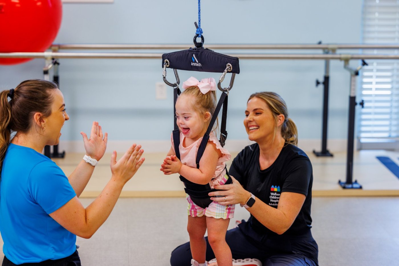 Young child cheering during ZeroG therapy