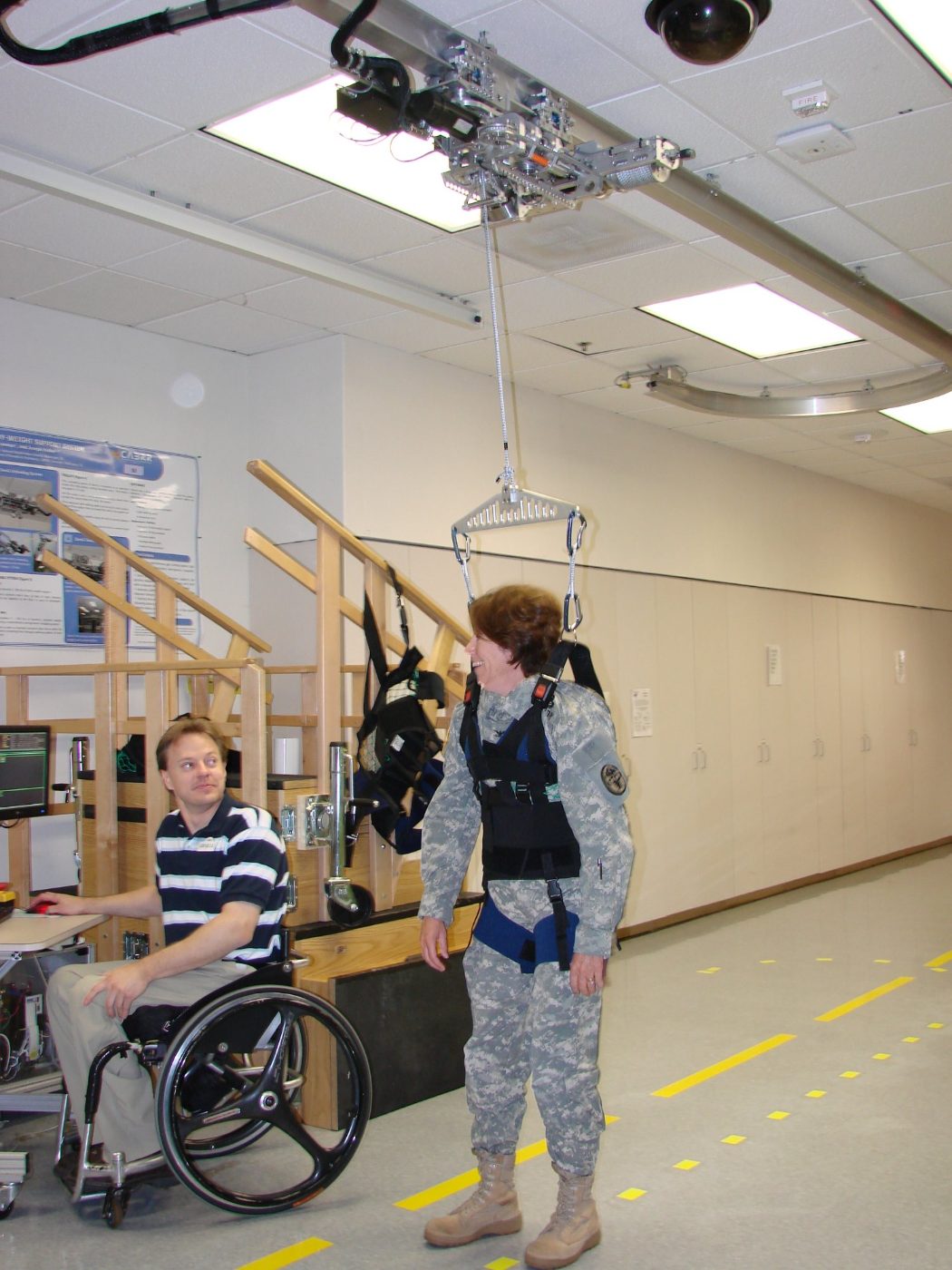 Aretech engineer testing an early ZeroG with a service member in the development lab